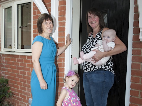 Cllr Sarah Creedy Welcoming new residents to a social housing project at the former White Hart Court site in Ripley.