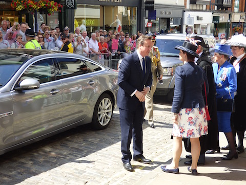 Prime Minister David Cameron is greeted by Guildford MP Anne Milton.